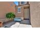 A cozy front entrance featuring a small garden and security gate at 6581 Netherseal Ave, Las Vegas, NV 89139