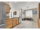Spacious kitchen with breakfast bar looking into a dining area at 6581 Netherseal Ave, Las Vegas, NV 89139