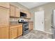 Kitchen featuring stainless steel appliances and light wood cabinetry at 6581 Netherseal Ave, Las Vegas, NV 89139