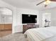 Main bedroom featuring carpet, television, and doorway to main bathroom at 6581 Netherseal Ave, Las Vegas, NV 89139