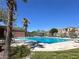 Community pool with lounge chairs and a shaded gazebo, perfect for relaxing and enjoying sunny days at 6581 Netherseal Ave, Las Vegas, NV 89139