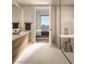 Modern bathroom featuring a double vanity, walk-in shower, and view into bedroom at 700 W Carson Ave # 2307, Las Vegas, NV 89106