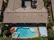 An aerial view of a luxurious pool area with a spa and lounge chairs at 7206 Laramie Ave, Las Vegas, NV 89113