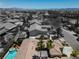 An aerial view showing a house with a beautiful pool and views of the surrounding community at 7206 Laramie Ave, Las Vegas, NV 89113