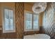 Luxurious bathroom featuring a soaking tub, stylish windows, elegant lighting, and chic fixtures for a serene bathing experience at 7206 Laramie Ave, Las Vegas, NV 89113