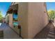 Exterior angle view showing a wall with a window reflecting the swimming pool and an adjacent walkway at 7206 Laramie Ave, Las Vegas, NV 89113