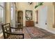 Foyer featuring tiled floors, a patterned rug, and an ornate hall chair at 7206 Laramie Ave, Las Vegas, NV 89113