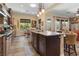 Spacious kitchen with an island featuring an undermount sink, and modern stainless appliances for convenient meal preparation at 7206 Laramie Ave, Las Vegas, NV 89113