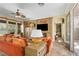 Comfortable living room with a fireplace, media center, and access to the patio at 7206 Laramie Ave, Las Vegas, NV 89113
