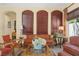 Elegant living room featuring hardwood floors, large windows, and comfortable seating, creating a welcoming atmosphere at 7206 Laramie Ave, Las Vegas, NV 89113