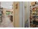 Walk in pantry featuring multiple shelves for storing cooking and baking supplies in a well organized storage area at 7206 Laramie Ave, Las Vegas, NV 89113