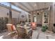 Charming covered patio with cozy seating and a fireplace, creating an ideal outdoor entertaining space at 7206 Laramie Ave, Las Vegas, NV 89113