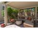 Cozy covered patio with comfortable seating, ideal for outdoor relaxation and entertaining on a stone paver patio at 7206 Laramie Ave, Las Vegas, NV 89113