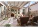 Relaxing covered patio featuring comfortable wicker furniture, fireplace and tiled flooring at 7206 Laramie Ave, Las Vegas, NV 89113