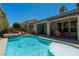 Beautiful pool and spa area features outdoor seating, perfect for enjoying the sun and backyard views at 7206 Laramie Ave, Las Vegas, NV 89113