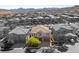 Spectacular aerial view of a well-maintained home in a vibrant community, set against a mountain backdrop at 749 Middle Beach St, Las Vegas, NV 89138
