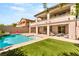 Wonderful backyard featuring a pool, patio, and grassy area, perfect for outdoor activities and entertaining at 749 Middle Beach St, Las Vegas, NV 89138
