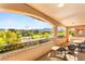 Spacious covered balcony featuring nice neighborhood and mountain views at 749 Middle Beach St, Las Vegas, NV 89138
