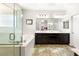 Bright bathroom with a double vanity, soaking tub, and glass-enclosed shower at 749 Middle Beach St, Las Vegas, NV 89138