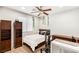 Comfortable bedroom featuring a bed, matching wood furniture, and natural light from a window at 749 Middle Beach St, Las Vegas, NV 89138