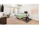 Bedroom featuring a desk, bed, and exercise equipment at 749 Middle Beach St, Las Vegas, NV 89138