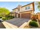 Beautiful home boasting a brick driveway, two-car garage, and meticulously maintained landscaping at 749 Middle Beach St, Las Vegas, NV 89138