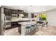 Well-equipped kitchen with stainless steel appliances, granite countertops, and an island with bar seating at 749 Middle Beach St, Las Vegas, NV 89138