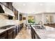 Modern kitchen featuring stainless steel appliances, granite countertops, and backyard views at 749 Middle Beach St, Las Vegas, NV 89138