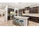Gorgeous kitchen featuring a central island, stainless steel appliances, and plenty of storage at 749 Middle Beach St, Las Vegas, NV 89138