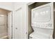 Efficient laundry space showcasing a stacked washer and dryer unit for space saving at 749 Middle Beach St, Las Vegas, NV 89138