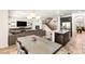 Open-concept living area featuring a dining area and fireplace, steps away from a modern kitchen at 749 Middle Beach St, Las Vegas, NV 89138