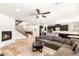 Inviting living room with a modern fireplace, and stairs leading to the second floor at 749 Middle Beach St, Las Vegas, NV 89138