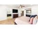 Spacious main bedroom with ensuite bathroom, TV, and ceiling fan at 749 Middle Beach St, Las Vegas, NV 89138