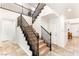 Elegant staircase with dark wood banister and plush carpeting at 749 Middle Beach St, Las Vegas, NV 89138