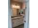 Bathroom featuring double sinks, granite countertops, and modern vanity lighting at 7855 Skyler Falls Ln, North Las Vegas, NV 89084