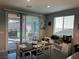 Bright dining area with sliding glass doors to the backyard patio and grill at 7855 Skyler Falls Ln, North Las Vegas, NV 89084