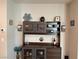 Custom built-in hutch in dining room with glass front cabinets and decorative shelving at 7855 Skyler Falls Ln, North Las Vegas, NV 89084