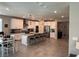 Open-concept kitchen with an island and seating, stainless steel appliances, and white cabinets at 7855 Skyler Falls Ln, North Las Vegas, NV 89084