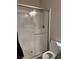 Modern shower with glass door and white subway tile at 7855 Skyler Falls Ln, North Las Vegas, NV 89084