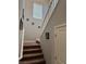Carpeted staircase with white railing and decorative wall art leading to the upper level at 7855 Skyler Falls Ln, North Las Vegas, NV 89084