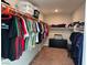 Walk-in closet with organized storage racks and drawers, providing ample space at 7855 Skyler Falls Ln, North Las Vegas, NV 89084