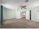 Open bedroom featuring soft carpet, ceiling fan, and closet at 8733 Country Pines Ave, Las Vegas, NV 89129