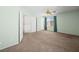 Bright bedroom featuring soft carpet, ceiling fan, and closet for storage at 8733 Country Pines Ave, Las Vegas, NV 89129