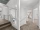 Upstairs hallway with natural light and neutral carpet, leads to various rooms of the house at 8733 Country Pines Ave, Las Vegas, NV 89129