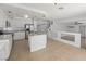 Open-concept kitchen featuring an island, stainless steel appliances, and a view of the living area at 8733 Country Pines Ave, Las Vegas, NV 89129