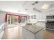 Bright kitchen with granite countertops, ample cabinets, and a view of the backyard at 8733 Country Pines Ave, Las Vegas, NV 89129