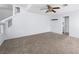 Cozy living room with plush carpet, neutral walls, and ample natural light at 8733 Country Pines Ave, Las Vegas, NV 89129