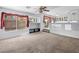 Spacious living room offering lots of natural light and seamlessly connecting to the kitchen area at 8733 Country Pines Ave, Las Vegas, NV 89129