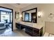 Contemporary bathroom with dual sinks and a large mirror at 8925 W Flamingo Rd # 117, Las Vegas, NV 89147