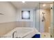 Bright bathroom featuring a soaking tub, walk-in shower, and sleek fixtures creating a serene and modern space at 8925 W Flamingo Rd # 117, Las Vegas, NV 89147